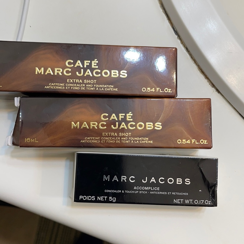 One concealer and to foundations in dark brown